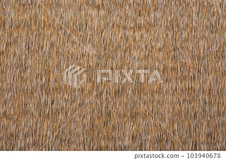 Close up dry straw texture wall background. Close up dry straw texture wall background. 103940678