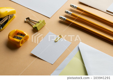 Flat lay of yellow pencils, sharpener and white paper with copy space on yellow background Flat lay of yellow pencils, sharpener and white paper with copy space on yellow background 103941291