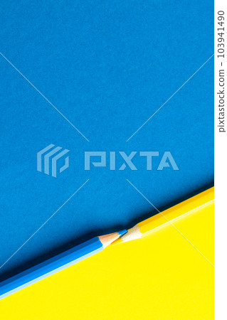 Close up of yellow and blue pencils with copy space on yellow and blue background Close up of yellow and blue pencils with copy space on yellow and blue background 103941490