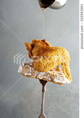 Fried chicken wing with a waffle 103942661