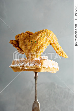 Fried chicken wing with a waffle 103942662