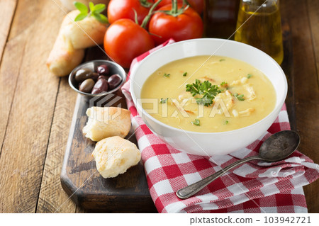 Creamy lemon chicken soup 103942721