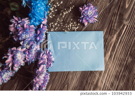 Violet, blue and pink chrysanthemum. A bouquet of chrysanthemums on wooden background with copy space. Chrysanthemum Flower Close up. Violet, blue and pink chrysanthemum. A bouquet of chrysanthemums on wooden background with copy space. Chrysanthemum Flower Close up. 103942933