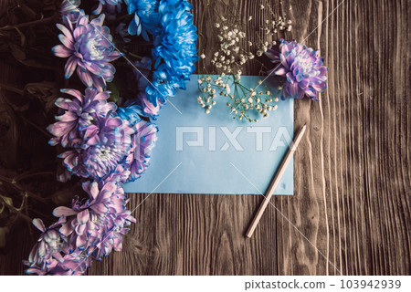 Violet, blue and pink chrysanthemum. A bouquet of chrysanthemums on wooden background with copy space. Chrysanthemum Flower Close up. Violet, blue and pink chrysanthemum. A bouquet of chrysanthemums on wooden background with copy space. Chrysanthemum Flower Close up. 103942939