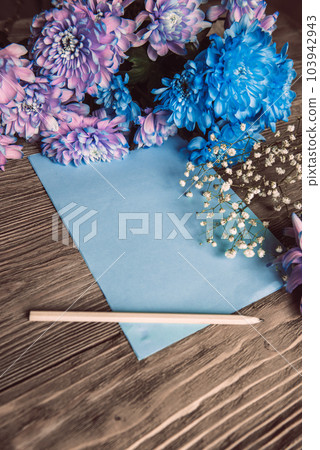 Violet, blue and pink chrysanthemum. A bouquet of chrysanthemums on wooden background with copy space. Chrysanthemum Flower Close up. Violet, blue and pink chrysanthemum. A bouquet of chrysanthemums on wooden background with copy space. Chrysanthemum Flower Close up. 103942943