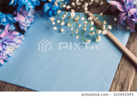 Violet, blue and pink chrysanthemum. A bouquet of chrysanthemums on wooden background with copy space. Chrysanthemum Flower Close up. Violet, blue and pink chrysanthemum. A bouquet of chrysanthemums on wooden background with copy space. Chrysanthemum Flower Close up. 103942945