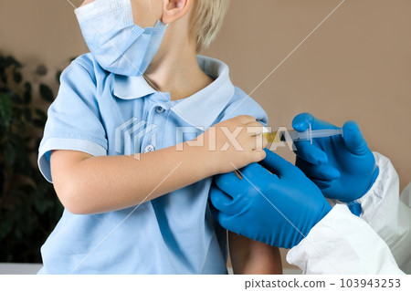 Doctor vaccinating baby boy in clinic. Little child get an injection. Pediatrician vaccinating 3 old years kid. Vaccine for infant child. Child's Immunization, Children's Vaccination, Health concept Doctor vaccinating baby boy in clinic. Little child get an injection. Pediatrician vaccinating 3 old years kid. Vaccine for infant child. Child's Immunization, Children's Vaccination, Health concept 103943253