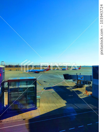 Boryspil, Ukraine - January 31, 2022: Airport panoramic view. Airport apron overview. Aircrafts at the airport gates. Kiev Boryspil International airport. Boryspil, Ukraine - January 31, 2022: Airport panoramic view. Airport apron overview. Aircrafts at the airport gates. Kiev Boryspil International airport. 103943724