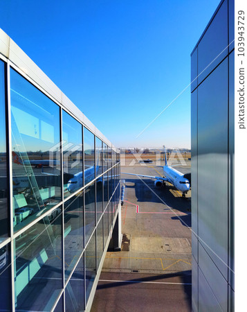 Boryspil, Ukraine - January 31, 2022: Airport panoramic view. Airport apron overview. Aircrafts at the airport gates. Kiev Boryspil International airport. Boryspil, Ukraine - January 31, 2022: Airport panoramic view. Airport apron overview. Aircrafts at the airport gates. Kiev Boryspil International airport. 103943729