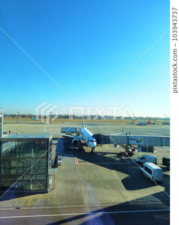 Boryspil, Ukraine - January 31, 2022: Airport panoramic view. Airport apron overview. Aircrafts at the airport gates. Kiev Boryspil International airport. Boryspil, Ukraine - January 31, 2022: Airport panoramic view. Airport apron overview. Aircrafts at the airport gates. Kiev Boryspil International airport. 103943737