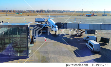 Boryspil, Ukraine - January 31, 2022: Airport panoramic view. Airport apron overview. Aircrafts at the airport gates. Kiev Boryspil International airport. Boryspil, Ukraine - January 31, 2022: Airport panoramic view. Airport apron overview. Aircrafts at the airport gates. Kiev Boryspil International airport. 103943738