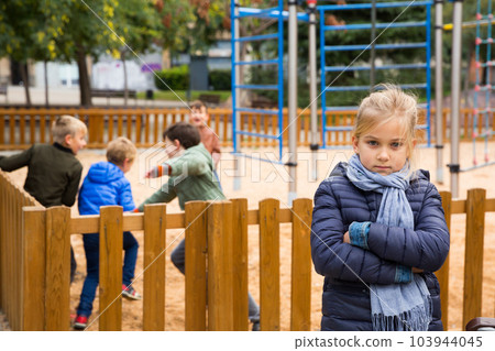 Offended girl on playground 103944045