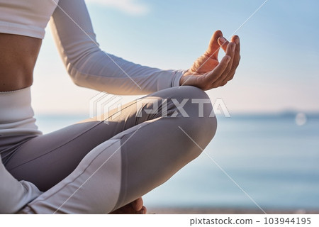 Young woman doing yoga in nature. Female wearing sport clothes in lotus figure. Young woman doing yoga in nature. Female wearing sport clothes in lotus figure. 103944195
