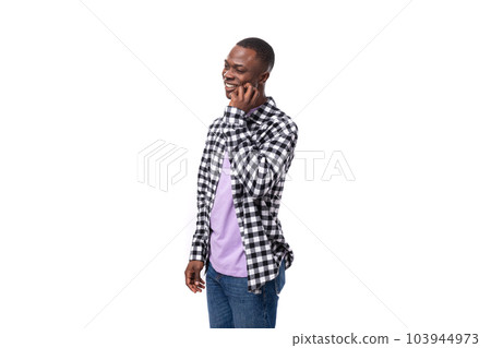modest shy young american guy with short haircut dressed casually on white background with copy 103944973