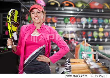 female is standing in uniform with new padel rocket 103945262