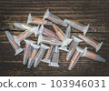 Medical plastic test tubes for analysis on brawn wooden table. Unusual items that can be used for dog nosework training. Beautiful photo for web site, banner, design decoration, poster, print, card. 103946031
