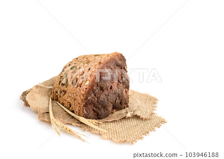 A slice of homemade grain bread on white 103946188