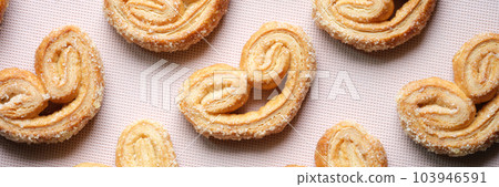 Puff pastry cookies with palms or elephant ears, caramelized and crunchy dough 103946591