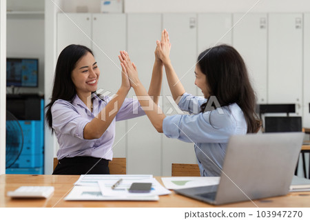 Happy asian business people employee celebrating while reading email good news. business account and finance 103947270