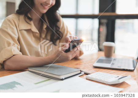 Beautiful Businesswoman completes KYC using an online banking program in order to open a digital savings account. The definition of cyber security 103947328