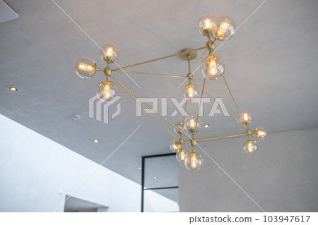 Modern loft chandelier in modern luxury minimalist light interior 103947617