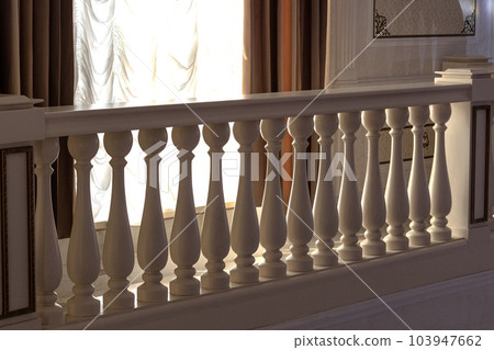 Fences made of stone railings with balusters in a classic interior 103947662