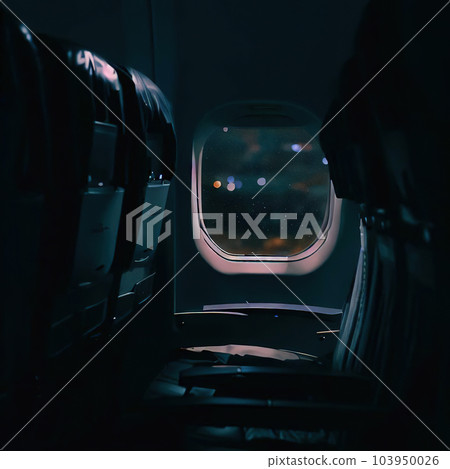 Looking out of the window of the plane, sitting in the cabin,night sky  103950026