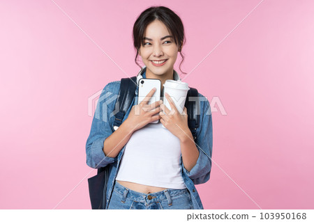 Portrait of young Asian woman student standing with smartphone coffee and backpack.College Teenager University concept. 103950168