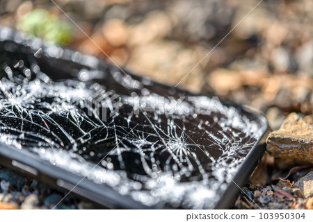 The LCD screen of the smartphone that was dropped from the motorcycle and the screen cracked The LCD screen of the smartphone that was dropped from the motorcycle and the screen cracked 103950304