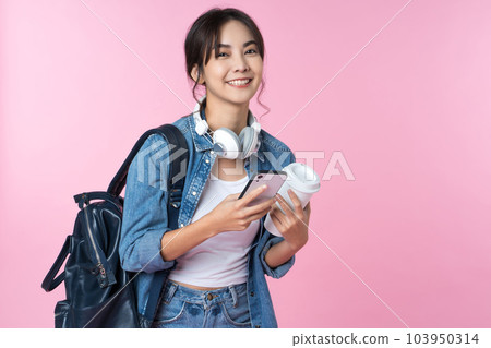 Portrait of young Asian woman student standing with smartphone coffee and backpack.College Teenager University concept. 103950314