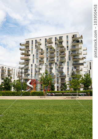 Modern multi-storey new house in Vienna in Austria, near a playground, a residential area of the city Modern multi-storey new house in Vienna in Austria, near a playground, a residential area of the city 103950458