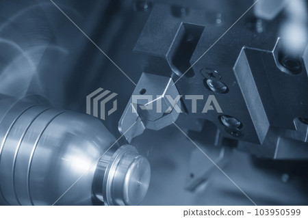 The  CNC lathe machine forming  cutting the metal shaft parts. 103950599