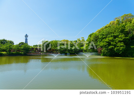 A view of Tsutenkaku from the Wake Bridge over Kawazoko Pond Fresh green leaves A view of Tsutenkaku from the Wake Bridge over Kawazoko Pond Fresh green leaves 103951191