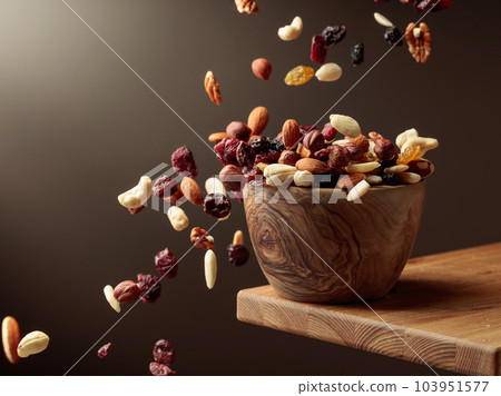 Flying dried fruits and nuts. 103951577