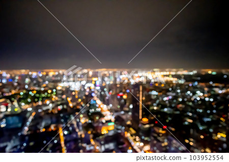 Blurred image bokeh of Bangkok cityscape, night top view in the business district in Thailand. Blurred image bokeh of Bangkok cityscape, night top view in the business district in Thailand. 103952554