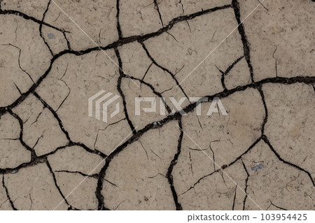 Crack. Dry soil. The global shortage of water on the planet. Global warming and greenhouse effect concept. The parched soil. Baraje. Soil drought cracked texture. Crack. Dry soil. The global shortage of water on the planet. Global warming and greenhouse effect concept. The parched soil. Baraje. Soil drought cracked texture. 103954425