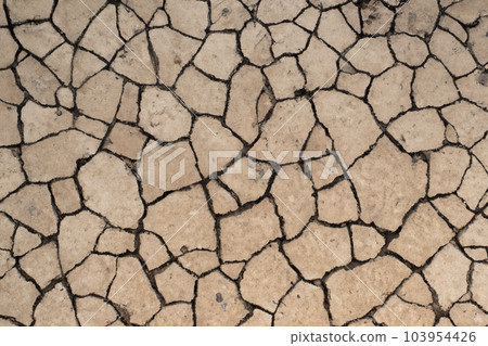 Crack. Dry soil. The global shortage of water on the planet. Global warming and greenhouse effect concept. The parched soil. Baraje. Soil drought cracked texture. 103954426