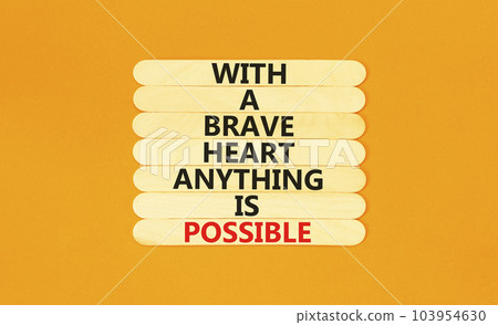 Possible symbol. Concept words With a brave heart anything is possible on wooden stick on beautiful orange table orange background. Business motivational brave heart possible concept. Copy space Possible symbol. Concept words With a brave heart anything is possible on wooden stick on beautiful orange table orange background. Business motivational brave heart possible concept. Copy space 103954630