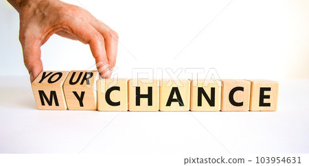 Your or my chance symbol. Businessman turns wooden cubes and changes words 'my chance' to 'your chance'. Beautiful white background, copy space. Business and your or my chance concept. 103954631