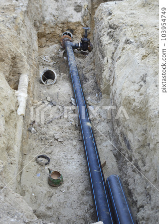 technical pit with a pipe, repair of communications. replacement of water pipes 103954749