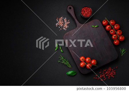 Ingredients for cooking cherry tomatoes, salt, spices and herbs Ingredients for cooking cherry tomatoes, salt, spices and herbs 103956800