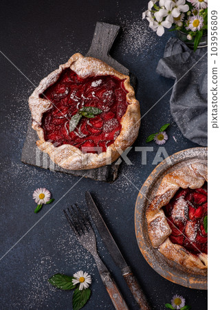 Delicious fresh sweet homemade rustic style strawberry tart Delicious fresh sweet homemade rustic style strawberry tart 103956809