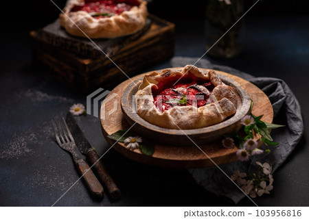 Delicious fresh sweet homemade rustic style strawberry tart Delicious fresh sweet homemade rustic style strawberry tart 103956816