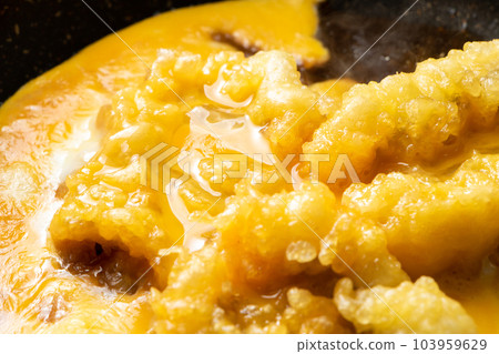 Tempura (conger eel) egg binding cooking scene. Fried leftovers remake image. 103959629