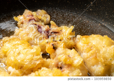Leftover fried food (octopus tempura) remake cooking scene. Boil in a frying pan containing mentsuyu and water to bind the egg. Leftover fried food (octopus tempura) remake cooking scene. Boil in a frying pan containing mentsuyu and water to bind the egg. 103959850