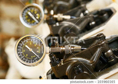 model of a vehicle engine, engine exhaust valve and intake valve, spring valve of the engine and auto spare parts, machine parts damaged from work. 103960165
