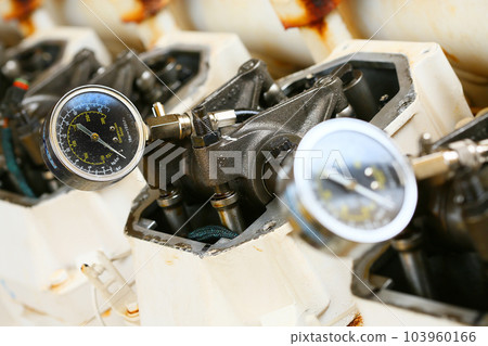 model of a vehicle engine, engine exhaust valve and intake valve, spring valve of the engine and auto spare parts, machine parts damaged from work. model of a vehicle engine, engine exhaust valve and intake valve, spring valve of the engine and auto spare parts, machine parts damaged from work. 103960166