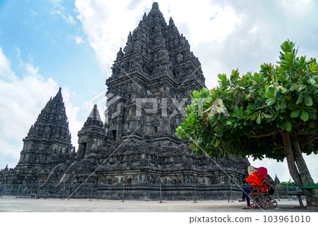 Tourists resting under a tree at Prambanan temple Tourists resting under a tree at Prambanan temple 103961010