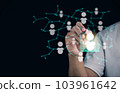 Selection concept. This is choosing person to join an organization or support a cause. A man points to a best person in hologram. Network society. 103961642