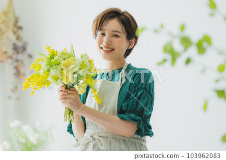 A woman holding a vase A woman holding a vase 103962083